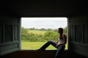 Woman_sitting_in_a_window